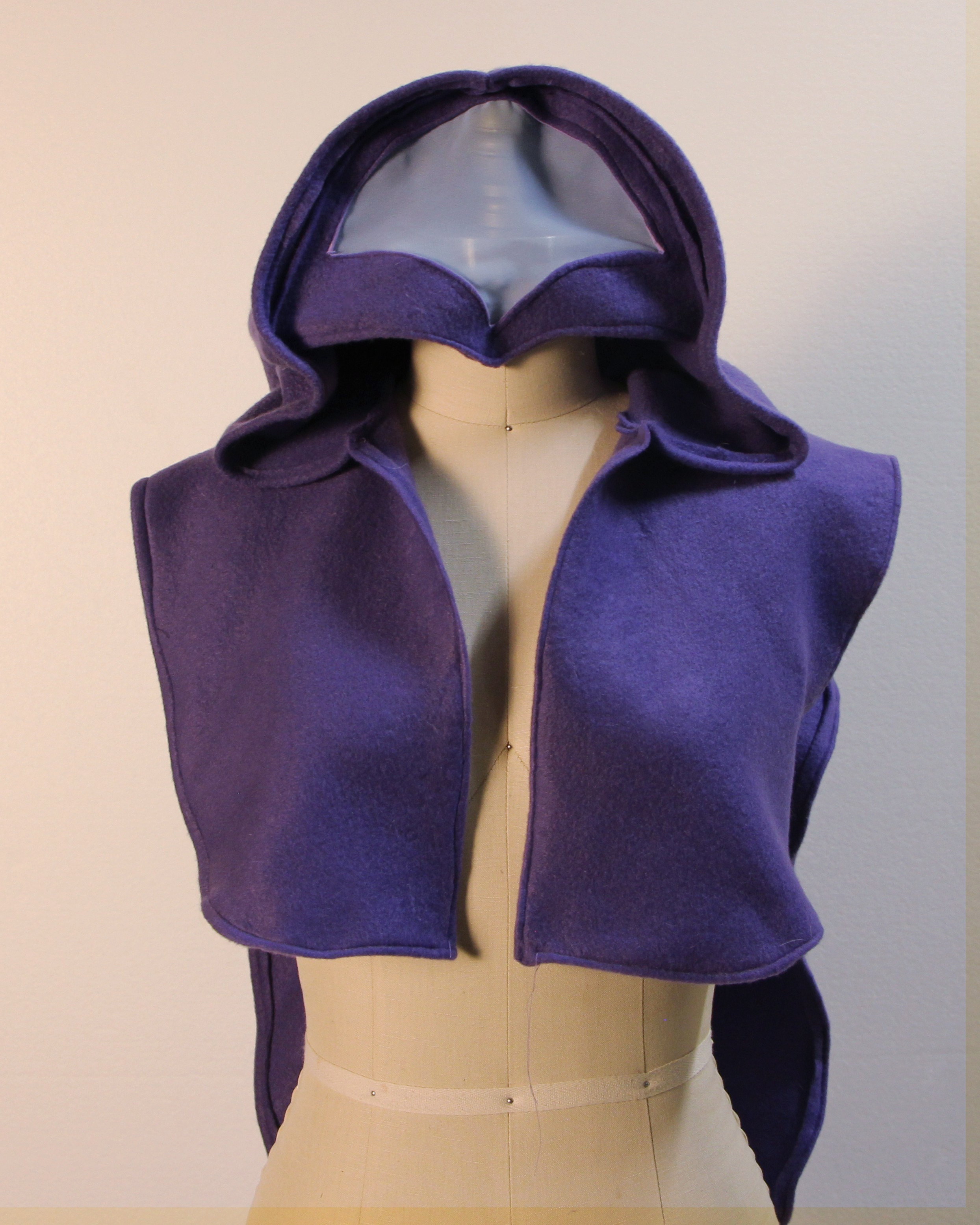 Purple fleece cape with hood on mannequin, front